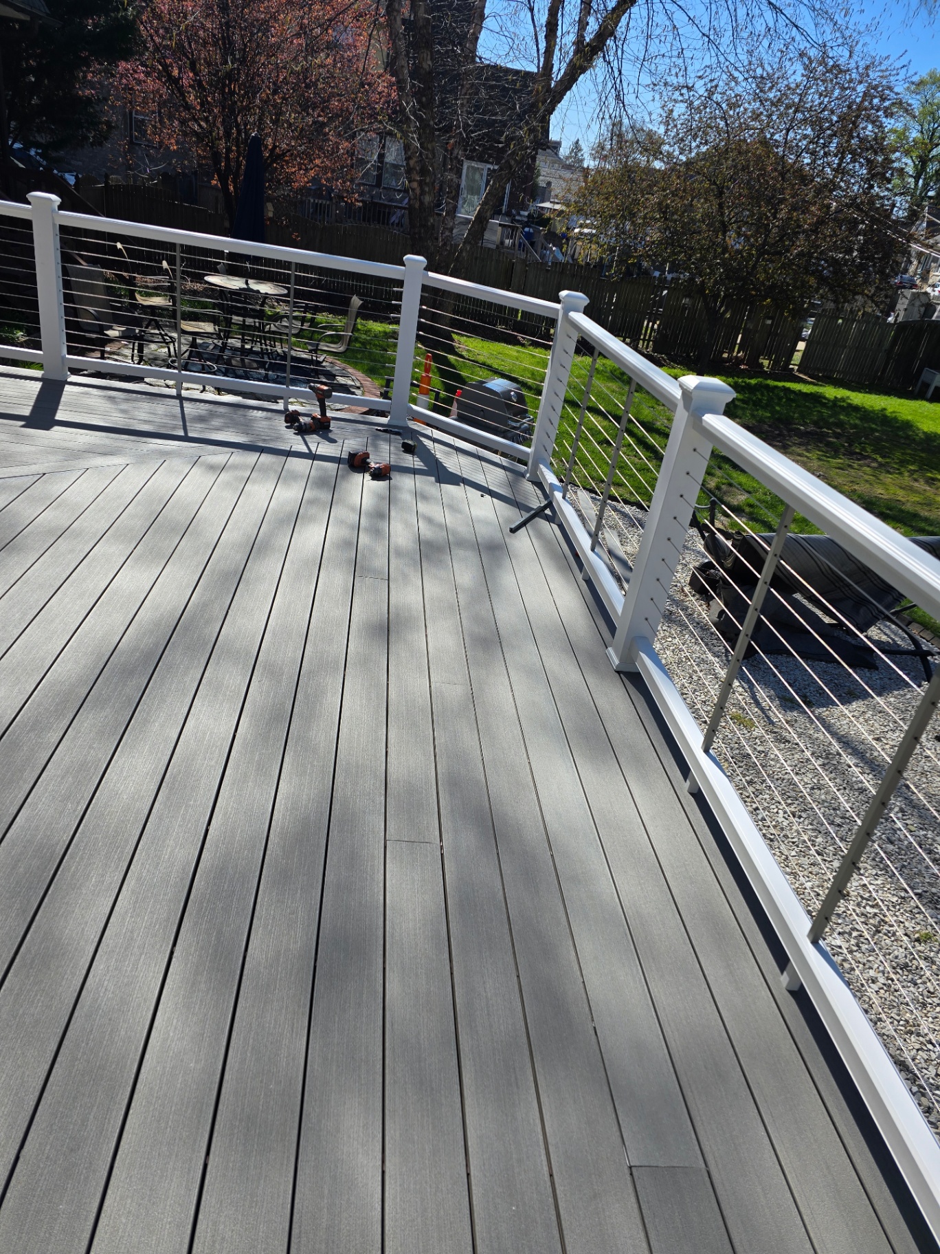 Overhead view of finished composite deck with white cable railings
